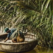 Man on a basket boat in Hoi An, Vietnam