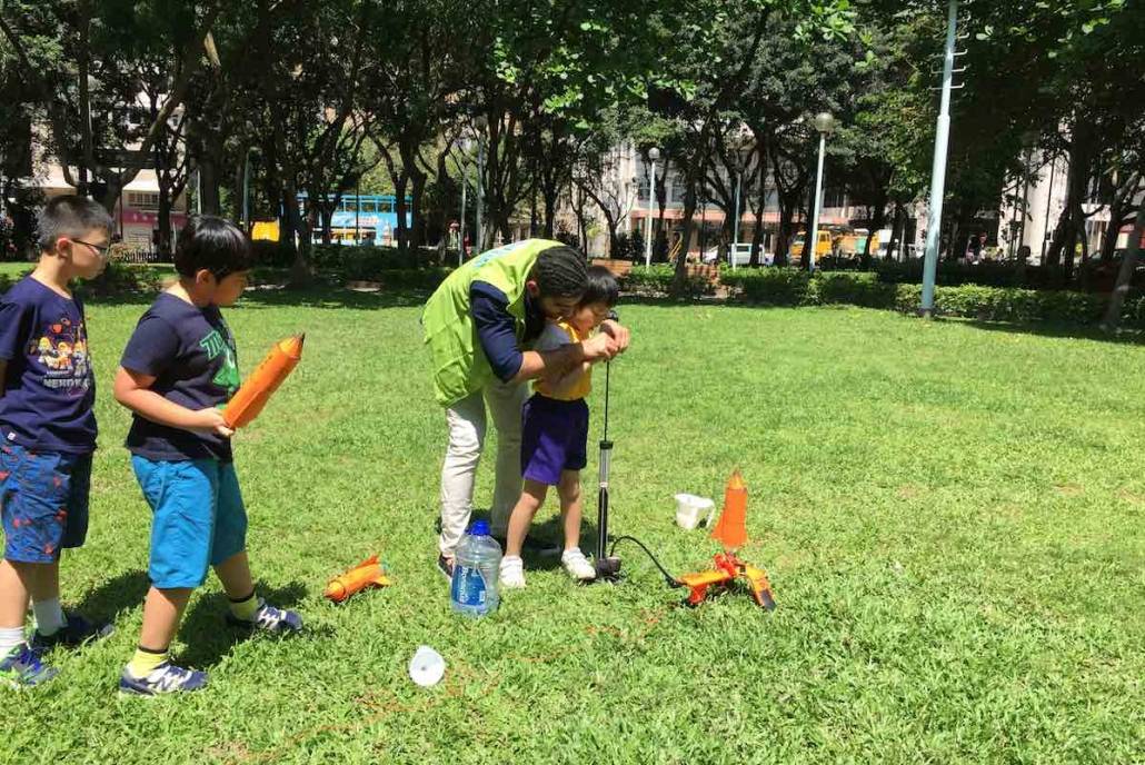 Kids playing sports in a park at ActiveKids Winter Camp HK