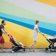 Expat family of four in front of a colourful wall in Hong Kong