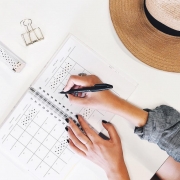 Girl writing on her planner